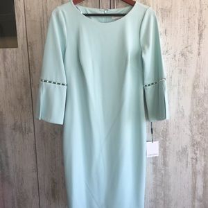 Calvin Klein with faux pearls at sleeves